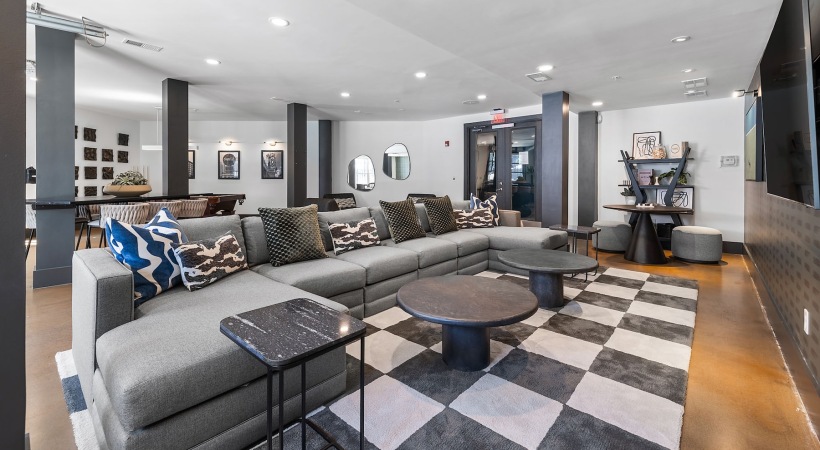 a clubroom with a couch and a tv