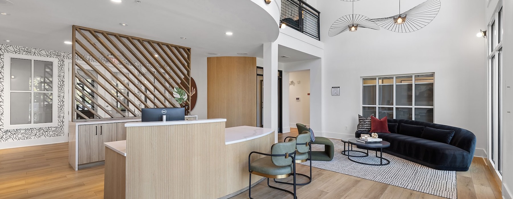a clubroom with a couch, tables and chairs