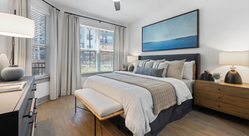 a bedroom with a bed and two nightstands