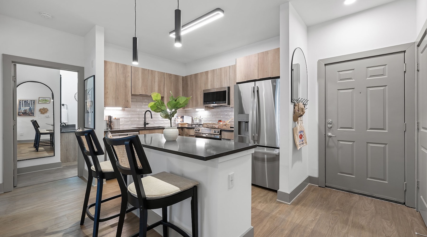 a kitchen with an island and chairs