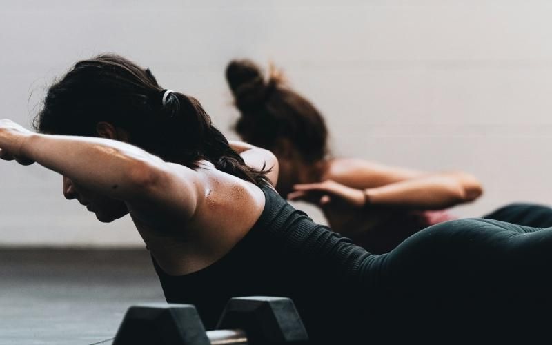 women working out on gym floor