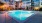 a swimming pool lit at night