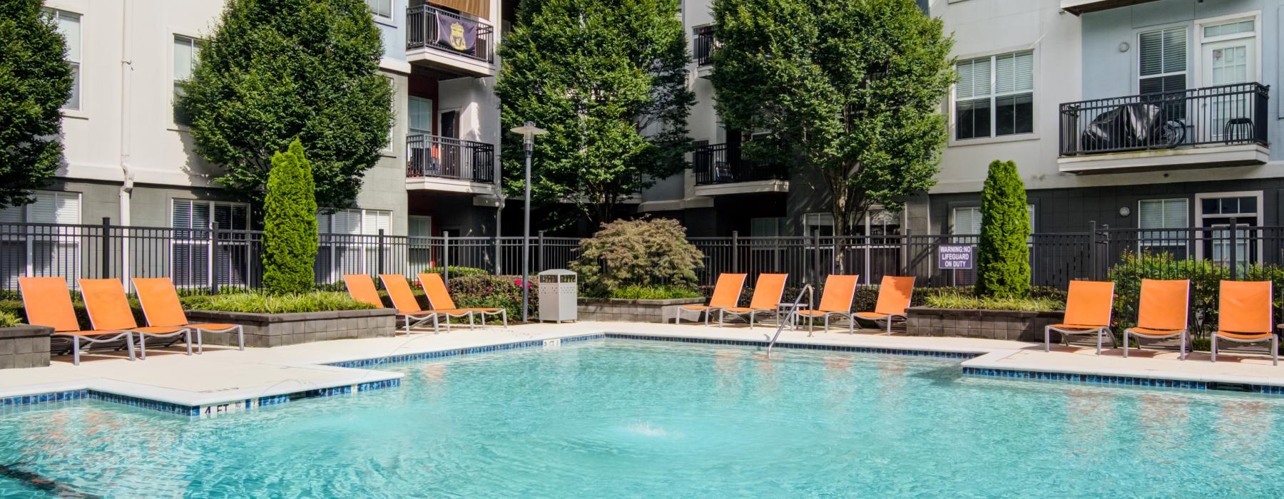 a pool with chairs around it