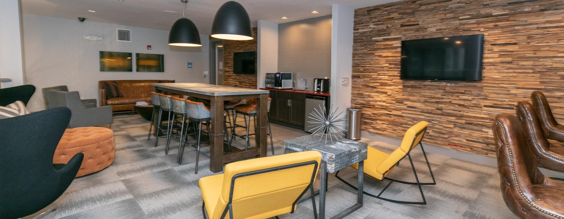 clubroom with mounted tv on stone wall