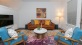 a living room with a couch and chairs